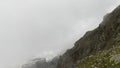 Fog in the mountains. Majestic beautiful mountains and rocks. Climbing Kazbek from the north