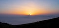 Fog in mountains. White wavy fog at the sunrise. landscape of mountains with the sun