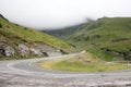 Fog over highway to mountains. Transfagarasan road. Romania Royalty Free Stock Photo