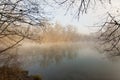 fog over the lake, cold morning, late autumn in park