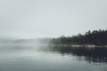 Fog over the lake. Early morning on Ladoga lake in Karelia, Russia. Royalty Free Stock Photo