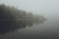 Fog over the lake. Early morning on Ladoga lake in Karelia, Russia. Royalty Free Stock Photo