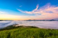 Fog over mountain and forest on sunrise Royalty Free Stock Photo