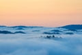 Fog over mountain and forest on sunrise Royalty Free Stock Photo