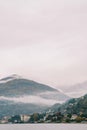 Fog over the mountains on the shores of Lake Como. Italy Royalty Free Stock Photo