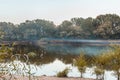 Fog over the river. The river Dniester, blue smoke, smog from the fires. Yellow-green trees on the bank Royalty Free Stock Photo