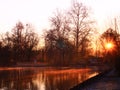 Fog over the water in the countryside at sunrise Royalty Free Stock Photo