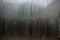 Fog and raindrops on window glass, dark background and lantern l Royalty Free Stock Photo