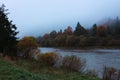 Fog on the river in autumn mountains. Frosty morning in mountains at the riverside. Tranquil autumn landscape with river Royalty Free Stock Photo