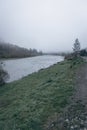 Fog on the river in autumn mountains. Frosty morning in mountains at the riverside. Tranquil autumn landscape with river Royalty Free Stock Photo