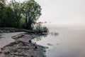 Fog on the river bank Royalty Free Stock Photo