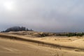 Fog rolling into the sand dunes on the Pacific Coast near Lakeside, Oregon, USA Royalty Free Stock Photo