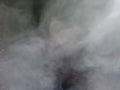 Fog or Smoke special effect, light gray smoke on black background. Royalty Free Stock Photo