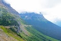 Fog surrounds a narrow road in Glacier National Park. Royalty Free Stock Photo