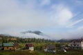 Fog in valley on village.Morning