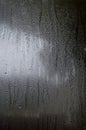 Fog and raindrops on window glass, dark background and lantern l Royalty Free Stock Photo