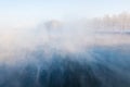 Fog winter landscape on the river Fabulous misty view of lake Frosty morning. Cold weather background concept. Abstract Royalty Free Stock Photo