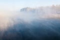 Fog winter landscape on the river Fabulous misty view of lake Frosty morning. Cold weather background concept. Abstract Royalty Free Stock Photo