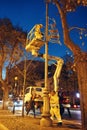 Foggia, Italy, December 01, 2023, Workers in mobile crane basket installing Christmas decorations on street lamp Royalty Free Stock Photo