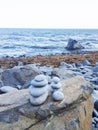 fogging sea and stones pyramids Royalty Free Stock Photo