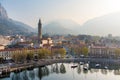 Foggy aerial sunrise cityscape of Lecco town on spring day. Picturesque waterfront of Lecco town located between famous Lake Como