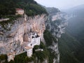 Foggy aerial view of Madonna della Corona Sanctuary