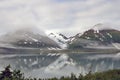 Foggy Alaska landscape lake, mountains and forest
