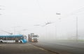 Foggy autumn day and urban transport highway Royalty Free Stock Photo