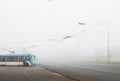 Foggy autumn day and urban transport highway Royalty Free Stock Photo