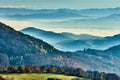 A foggy autumn landscape with mountain , the sun breaking through the clouds. View from Vrsatec hill, Slovakia. Royalty Free Stock Photo