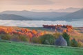 Foggy autumn morning in mountain village Royalty Free Stock Photo