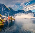 Foggy autumn scene of Hallstatt lake. Royalty Free Stock Photo