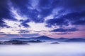 Foggy autumn or summer landscape. Misty foggy morning with sunrise in a valley of Bohemian Switzerland park. Detail of forest. Royalty Free Stock Photo