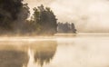 Foggy autumnal morning by the lake. Natural sunrise light. Trondheim area in Norway Royalty Free Stock Photo