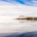 Foggy autumnal morning by the lake. Natural sunrise light. Trondheim area in Norway Royalty Free Stock Photo