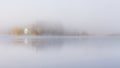 Foggy autumnal morning by the lake. Natural sunrise light. Trondheim area in Norway Royalty Free Stock Photo