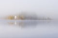 Foggy autumnal morning by the lake. Natural sunrise light. Trondheim area in Norway Royalty Free Stock Photo