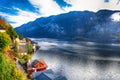 Foggy autumnal sunrise at famous Hallstatt lakeside town reflect Royalty Free Stock Photo