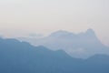 Foggy blurry distant mountains at evening dusk