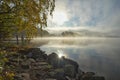 Foggy bright autumn morning on the lake
