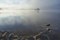 Foggy bright autumn morning on the lake