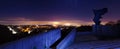 Foggy city at night from above with memorial statue