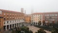 foggy cityscape aerial drone view of town center Cremona, Lombardy, Italy