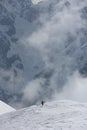 Foggy clouds rising from alpine mountain forest Royalty Free Stock Photo