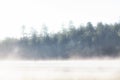 Foggy Cool Morning on Lake in Woods Royalty Free Stock Photo