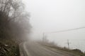 Foggy Country Road. Fog creates a feel of emptiness as it leads to seemingly nowhere. Ilisu, Gakh, Azerbaijan