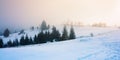 foggy countryside at dawn. beautiful rural landscape in wintertime Royalty Free Stock Photo
