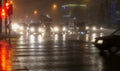 Foggy night crossing with pedestrains, wet asphalt road, street and car lights Royalty Free Stock Photo