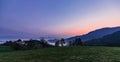 Foggy dawn on mountain and valley in Slovenija. Purple sky Royalty Free Stock Photo