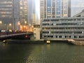 Foggy day in downtown Chicago as commuters rush down Randolph Street bridge.